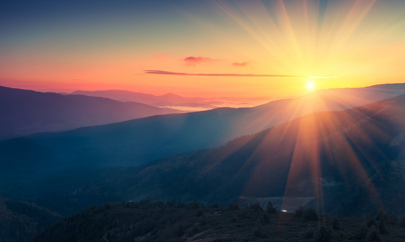 Panoramic view of colorful sunrise in mountains. Filtered image